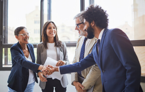 A group of businesspeople shaking hands