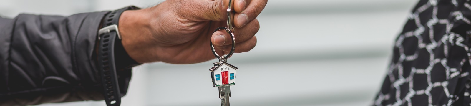 person holding house key